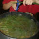 To make pine needle tea, fill a pot of boiling water with pine needles.