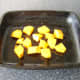 Chopped butternut squash prepared for roasting