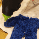 Glue around the edge of the stuffed animal to secure the fabric to the front of your stuffed animal.