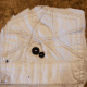 Sew two buttons onto the fabric for the head.