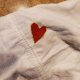 Cut a heart shape from your red fabric and place it.