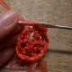 To make a bullion stitch: Each time you wrap the yarn pull it to the widest part of the hook, just before the flat part. This will make it easier to do the next step.