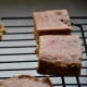 Cut your baked treat into 12 bars. You may have some with rounded edges. Set them on a wire rack to cool to room temperature.