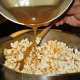 Mixing syrup into popcorn