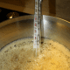Bubbling sugar syrup with candy thermometer