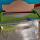 A tiny cutter slides along the bag, cutting it cleanly
