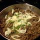 Once the meat is fully cooked (to 160 degrees), add onions and peppers
