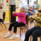 Older Adults Doing Tai Chi Sitting in Chairs