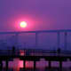 Coronado Ferry and the sun rise over the Coronado Bay Bridge.