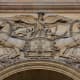 Detailed carvings over the entrance gate to The Louvre in Paris