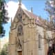The Loretto Chapel stands next to the larger St. Francis Cathedral in Santa Fe.