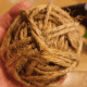 Secure the end of the twine to the bottom of the ball using hot glue. 