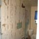 Paneling stripped from vanity wall..this looks bad