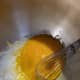 In a large mixing bowl, add the egg, egg yolks, vanilla, sugar, and honey. Whisk to combine.