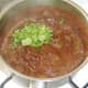 Chopped coriander is added to mutton curry