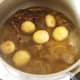 Whole baby potatoes are added to mutton stew