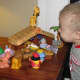 My son and the Fisher Price Little People Nativity set. There's supposed to be an angel on top...