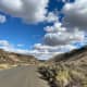A long desert highway. Up ahead—a shimmering waterfall.