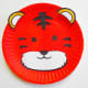 The finished paper plate tiger. For this craft, a white paper plate was painted orange with acrylic paint. You could also purchase orange paper plates for this craft.