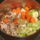 Vegetables and seasonings are added to chicken wings bones