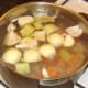 Water is added and the chicken stock is brought to a simmer