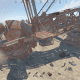 Run down the arm that's digging and into one of the cabins on either side. Both have a control console