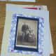 Vintage photos (photocopies) and little flat jewels add charm.