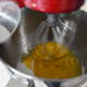 Pour the sugar into the eggs. Set your mixer on the highest or second-highest setting. Let it beat the eggs for at least 7 minutes. You want it to be white and fluffed up.