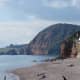 Westwards, at the further end of Sidmouth beach