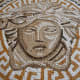 The mosaic is heavy. You are responsible for installing it yourself. The art piece is of the Versace logo. The logo is of Medusa, a Greek mythological character. 