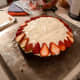 Cut up strawberries and align them around the top edge of the cake. I cut the strawberries into four pieces. You could use a different fruit to make this effect, I would suggest a red fruit.