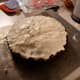 Mix the frosting ingredients in a processor. I would slowly add the confectioners sugar. You want the frosting to be thick, not runny. Drop spoonfuls of it on top of the cake. Gently spread the cream cheese frosting. Don't swirl in the chocolate. 