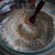 In a large bowl, mix together the flour, salt, and baking soda. Set aside.