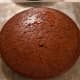 Poke the top surface with a fork. Cut lines or small holes into the cake with a knife. Do not do so much cutting and stabbing that your sponge loses its shape. Cover the sponge in pudding. I use a spoon to spread things out.