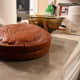 Add the second sponge to the cake. You may have to flip the sponge onto one surface and then onto the sponge so that it is round side up and flat side down. It's best if the two flat sides align together.