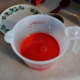 In a small bowl or 2 cup measuring cup, mix together the red food dye, vinegar, and buttermilk. 