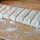 Cut the dough across into 2.5- 3cm wide strips