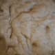 Add the flour (in increments) and salt. Mix everything until fully combined. Cover the bowl with a damp towel. Let the dough rest for 30 minutes. Switch to the dough hook. Mix for 6-7 minutes.