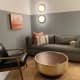 The room is spacious. It's provided us with a coffee table, a chair, and a sofa bed.