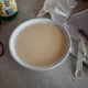 Mix together the condensed milk, evaporated milk, and heavy whipping cream. Add in the lemon juice and cardamom. Taste check it. Pour the milk onto the cake. You may need to redistribute milk that pools around the sides of the pan.