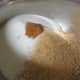 Adding the sugar and cinnamon to the zwieback crumbs