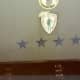 The 4 stars indicate the aircraft flew a 4 star general. Above that is a Jolly Green Giant emblem. Top emblem cropped because image is of an obscene gesture.