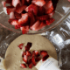 Whip up waffle mix. Slowly add in chopped strawberries.