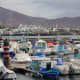 The marina of Playa Blanca with the mountains in the background