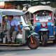 Modes of Transportation from Around the World. Colourful 3-wheeler tuk-tuk taxis on the streets of Bangkok, Thailand