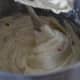 On a medium-low setting, add in the vanilla and eggs, one at a time.