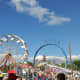 Ferris wheel and other rides at a fair. 