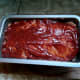 The sauce has been added.  The meatloaf can now be baked in an oven