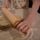 Roll the dough out long. Don't stretch the dough out too much to where it's thin.