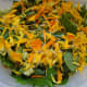 Make your salad in your salad bowl. I made a green salad with spinach, romaine, strawberry slices, avocado, and cucumber. Then I sprinkled the yellow and orange calendula petals on top and discarded the centers designed to become seeds. The centers a